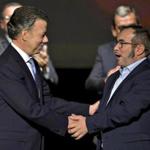 Colombian President Juan Manuel Santos (left) and FARC leader Timoleon Jimenez shook hands during the second signing of the peace agreement in Bogota on Thursday.