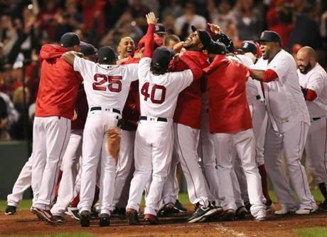 Boston-09/15/2016- Boston Red Sox vs Yankees- Sox players surround Hanley Ramirez as they celebrate his 9th inning winning 3-run homer.Boston Globe staff photo by John Tlumacki(sports)
