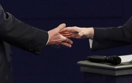 The hands of Republican U.S. presidential nominee Donald Trump and Democratic U.S. presidential nominee Hillary Clinton are seen as they shake hands at the end of their presidential town hall debate at Washington University in St. Louis, Missouri, U.S., October 9, 2016. REUTERS/Jim Young 
