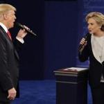 In this Sunday, Oct. 9, 2016, file photo, Republican presidential nominee Donald Trump and Democratic presidential nominee Hillary Clinton speak during the second presidential debate.