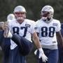 New England Patriots tight ends Rob Gronkowski (87) and Martellus Bennett (88) warm up during an NFL football team practice Wednesday, Oct. 26, 2016, in Foxborough, Mass. (AP Photo/Steven Senne)