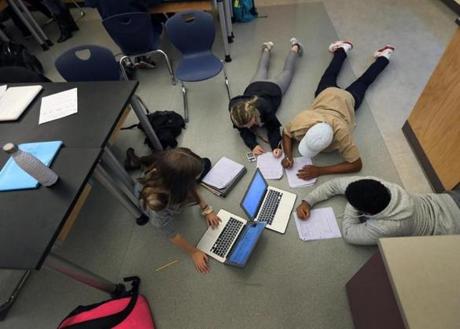 NATICK MA - 12/02/2016:Freshman students in a physics class work on the floor of the classroom as if in a home study group atmosphere at Natick High School. International PISA test results released, Natick HS is among the Massachusetts schools that took the international test and has used previous results to effectively boost its instruction in math, science and literacy -- making the school among the best in the world. (David L Ryan/Globe Staff Photo) SECTION: METRO TOPIC 06pisa
