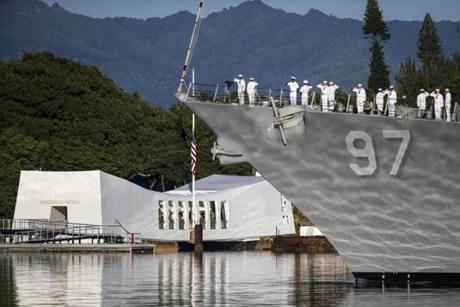 The USS Halsey performs a Pass-in-Review during a ceremony commemorating the 75th anniversary of the attack on Pearl Harbor at Kilo Pier on Dec. 7 in Honolulu, Hawaii.
