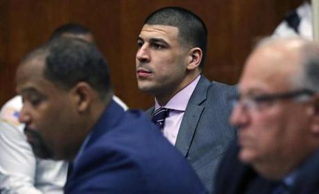 Former Patriots star Aaron Hernandez (center) sat in court on Wednesday.
