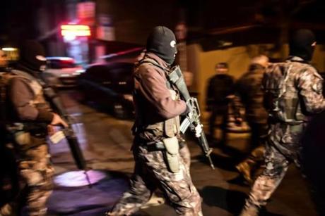 Turkish special force police officers patrol streets after a car bomb exploded near the stadium of football club Besiktas in Istanbul on Saturday. 
