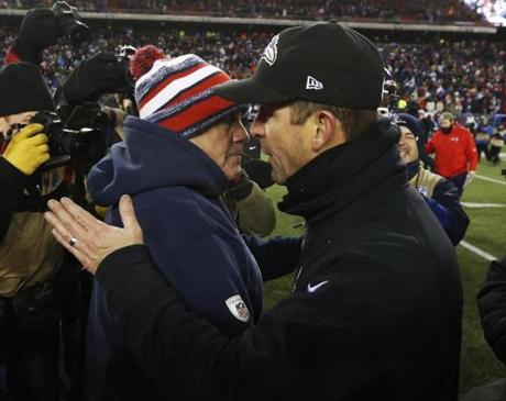New England Patriots head coach Bill Belichick, left, and Baltimore Ravens head coach John Harbaugh after an NFL divisional playoff football game Saturday, Jan. 10, 2015, in Foxborough, Mass. The Patriots won 35-31 to advance to the AFC Championship game. (AP Photo/Elise Amendola)
