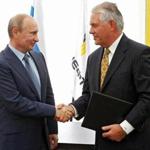 Russian President Vladimir Putin (left) and ExxonMobil CEO Rex Tillerson shook hands in 2012.