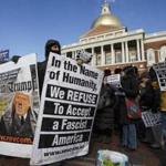 Protesters demonstrated against Donald Trump at the State House in Boston as part of nationwide rallies to have the Electoral College vote Hillary Clinton president instead.