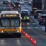 08bus - An MBTA bus drives down a dedicated lane converted from parking spaces on Broadway in Everett during a one week trial. The MBTA could use the project as a way to encourage other bus-only lane tests in traffic-snarled Boston. (Josh Reynolds for The Boston Globe)