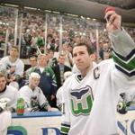FROM MERLIN ARCHIVE DO NOT RESEND TO LIBRARY Hartford Whalers captain Kevin Dineen waves to the fans Sunday, April 13, 1997, after he briefly addressed them at the end of the Whalers final game in Hartford, Conn. The Whalers defeated the Tampa Bay Lightning 2-1 to end their season and their stay in Hartford. (AP Photo/Richard Mei) Library Tag 08102008 Sports