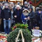 People mourn at a makeshift memorial for the victims of the Christmas market attack near the Kaiser-Wilhelm-Gedaechtniskirche (Kaiser Wilhelm Memorial Church) in Berlin on December 24, 2016. Germany hunts for possible accomplices of the suspected Berlin truck attacker Anis Amri, who was shot dead by Italian police in Milan on Friday, December 23, 2016. The Islamic State group has claimed responsibility for this week's attack on a Berlin Christmas market, in which 12 people were killed and dozens more wounded. / AFP PHOTO / John MACDOUGALLJOHN MACDOUGALL/AFP/Getty Images