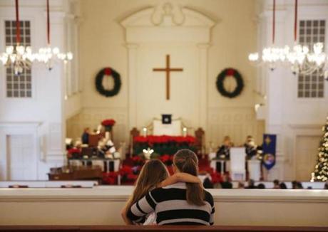 Amy Moore and her daughter, Samantha, 6, sat in the balcony for a service at The Plymouth Church in Framingham.
