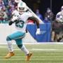 Miami Dolphins running back Jay Ajayi (23) rushes during the first half of an NFL football game against the Buffalo Bills Saturday, Dec. 24, 2016, in Orchard Park, N.Y. (AP Photo/Bill Wippert)