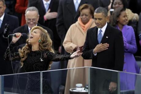 FILE - This Jan. 21, 2013 file photo shows President Barack Obama, right, as Beyonce sings the National Anthem at the ceremonial swearing-in at the U.S. Capitol during the 57th Presidential Inauguration in Washington. On Wednesday, President-elect Donald Trump picked 