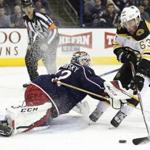 Columbus Blue Jackets' Sergei Bobrovsky, left, of Russia, makes a save against Boston Bruins' Brad Marchand during the first period of an NHL hockey game Tuesday, Dec. 27, 2016, in Columbus, Ohio. (AP Photo/Jay LaPrete)
