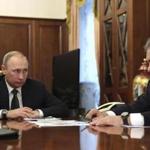 Russian President Vladimir Putin, left, listens to Defence Minister Sergei Shoigu in Moscow, Russia on Thursday, Dec. 29, 2016. Putin is ordering to scale down the Russian military presence in Syria. Putin made the statement Thursday while declaring that a cease-fire in Syria brokered by Russia and Turkey will start at midnight. (Mikhail Klimentyev/Sputnik, Kremlin Pool Photo via AP)