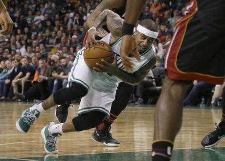 Boston Celtics guard Isaiah Thomas (4) drives the lane in the first quarter of an NBA basketball game against the Miami Heat, Friday, Dec. 30, 2016, in Boston. (AP Photo/Elise Amendola)
