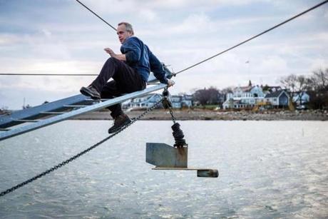 Kevin Norton prepared an outrigger on a fishing trip off the coast of Scituate. 
