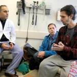 Boston, MA., 12/20/16, Ben Blake, 26, right, and his father Duane Blake, cq, meet with his doctor Parsia A. Vagefi, cq,. Ben was expected to die within months without a liver transplant. As it became clear he was too far down the wait list to get one in time, Mass. General surgeons came up with an unusual plan: take a liver from a donor with hepatitis C and then give Ben super powerful new hepatis C drugs after the transplant to cure the disease. It is the first such transplant at MGH but doctors predict the approach is poised to take off nationally for liver, kidney, heart and lung transplants. Alot of organs from donors with hepatitis C are currently discarded. Ben had his transplant a week or so ago. Suzanne Kreiter/Globe staff)
