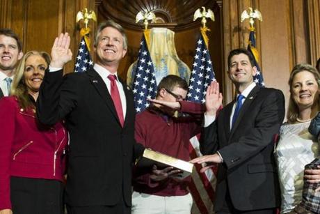 House Speaker Paul Ryan of Wis. administers the House oath of office to Rep. Roger Marshall, R-Kan.,Â during a mock swearing in ceremony on Capitol Hill in Washington, Tuesday, Jan. 3, 2017, as his son dabs, a pose made popular by NFL quarterback Cam Newton.Â (AP Photo/Zach Gibson)
