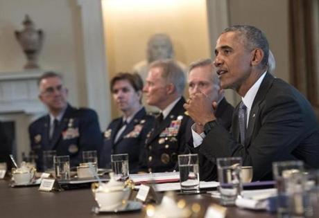 President Barack Obama spoke to the media while meeting with the Joint Chiefs of Staff and Combatant Commanders in the Cabinet Room at the White House Wednesday. 
