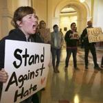 Protesters tried to drown out a press conference with Texas Lieutenant Governor Dan Patrick and Senator Lois Kolkhorst on Thursday at the Texas Capitol in Austin.