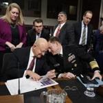 Director of National Intelligence James Clapper, left, talks with National Security Agency and Cyber Command chief Adm. Michael Rogers on Capitol Hill in Washington, Thursday, Jan. 5, 2017, at the conclusion of a Senate Armed Services Committee hearing: 