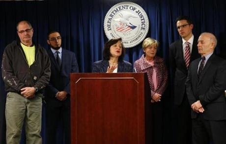 
Left: Scott McCloskey, the son of Philip McCloskey, US Attorney Camen Ortiz (center), and Mary and Mike Rizzo (3rd from right and far right) the parents of Jonathan Rizzo.

