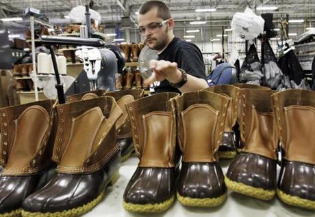 FILE - In this Dec. 14, 2011, file photo, Eric Rego stitches boots in the facility where LL Bean boots are assembled in Brunswick, Maine. L.L. Bean has a backlog of 51,000 orders for their famous boots that it intends to fill in the coming weeks. A company spokeswoman says harsh winter weather and the bootâ??s ongoing popularity are driving demand. (AP Photo/Pat Wellenbach, File)
