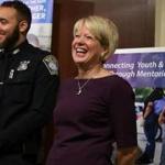 Boston police Officer Jeff Lopes stood with Wendy Foster, head of Big Brothers and Big Sisters Massachusetts Bay.