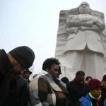 People prayed together in front of the Martin Luther King Jr. memorial on Monday in Washington, DC.
