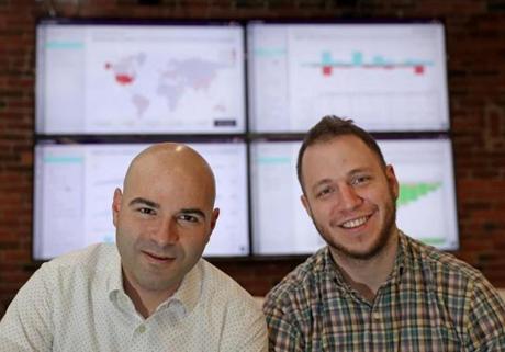 Apptopia executives Eliran Sapir (left) and Jonathan Kay. The monitors display crucial company data in real time.
