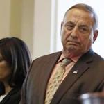 FILE - In this Monday, Dec. 19, 2016 file photo Maine Republican Gov. Paul LePage, right, and House Speaker Sara Gideon, D-Freeport, attend the Electoral College vote at the State House in Augusta, Maine. LePage says he had weight loss surgery and jokes that now 