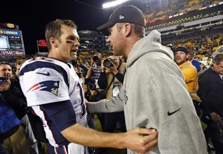FILE - In this Oct. 23, 2016, file photo, Pittsburgh Steelers quarterback Ben Roethlisberger, right, and New England Patriots quarterback Tom Brady, left, visit on the field after an NFL football game in Pittsburgh. A clip from Showtime's 