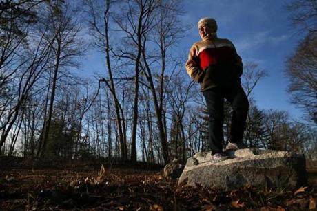 Woburn, MA - January 13, 2017: Donna Robbins poses for a portrait on the Aberjona Nature Trail along the Aberjona River near Well G in Woburn, MA on January 13, 2017. Well G and others were contaminated due to toxic dumping by several nearby companies. (Robbins was one of the plaintiffs in the landmark Woburn water pollution lawsuit in the early 1980s that was chronicled in the book and movie A Civil Action. Her son Carl Robbins III (better known as Robbie) died aged 9 of leukemia. He was among several children in the area who became ill or died of leukemia allegedly tied to the contamination of the water supply due to toxic dumping by several nearby companies. ) (Globe staff photo / Craig F. Walker) section: Lifestyle reporter:
