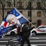 A street vendor held a flag bearing the likeness of President-elect Donald Trump in Washington.