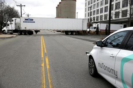 South Boston, MA -- 1/4/2017 - NuTonomy's driverless car pauses as a truck pulls out as it takes a spin around Drydock Ave. (Jessica Rinaldi/Globe Staff) Topic: 05driverlesscar Reporter: 
