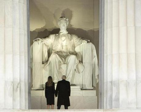 US President-elect Donald J. Trump (right) and incoming First Lady Melania Trump stood in front of the Lincoln Memorial in Washington D.C. Thursday night.
