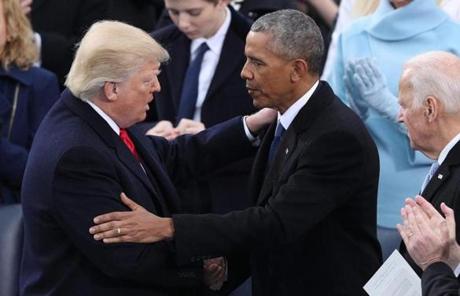 epa05735453 President Donald J. Trump (L) embraces former President Barack Obama (R) after he delivers his Inaugural address after taking the oath of office as the 45th President of the United States in Washington, DC, USA, 20 January 2017. Trump won the 08 November 2016 election to become the next US President. EPA/JUSTIN LANE
