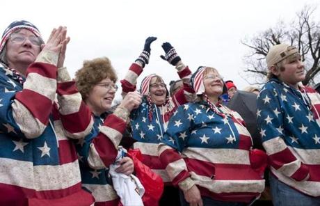 epa05736108 A group who travelled all the way from Gilman, Minnesota celebrates as Donald J. Trump takes the oath of office as he is sworn in as the 45th President of the United States in Washington, DC, USA, 20 January 2017. Trump won the 08 November 2016 election to become the next US President. EPA/Chris Usher
