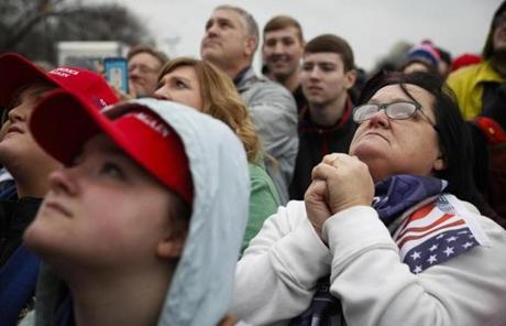 Supporters react as President-elect Donald Trump appears for his inauguration, Friday, Jan. 20, 2017, in Washington. (AP Photo/John Minchillo)
