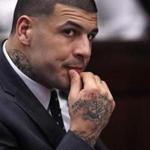 Former New England Patriots NFL football player Aaron Hernandez listens during a pretrial hearing at Suffolk Superior Court in Boston, Thursday, Jan. 19, 2017. Hernandez, who is serving a life sentence for the 2013 killing of Odin Lloyd, appeared with his lawyers before for his upcoming trial, where he is charged in the 2012 slayings of two men outside a Boston nightclub. (AP Photo/Charles Krupa, Pool)