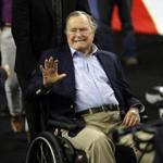 FILE - In this April 2, 2016, file photo, former President George H. W. Bush waves as he arrives at NRG Stadium before the NCAA Final Four tournament college basketball semifinal game between Villanova and Oklahoma in Houston. Houston-area media are quoting former President George H.W. Bush's chief of staff as saying that Bush has been hospitalized in Houston. (AP Photo/David J. Phillip, File)