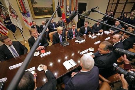 WASHINGTON, DC - JANUARY 23: U.S. President Donald Trump (C) leads a meeting with invited business leaders and members of his staff in the Roosevelt Room at the White House January 23, 2017 in Washington, DC. Business leaders included Elon Musk of SpaceX, Wendell Weeks of Corning, Mark Sutton of International Paper, Andrew Liveris of Dow Chemical, Alex Gorsky of Johnston & Johnson and others. (Photo by Chip Somodevilla/Getty Images)
