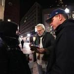 Boston, MA - 1/25/2017 - Boston Mayor Marty Walsh, and Jim Greene, Director of Emergency Shelter Commission at City of Boston talk to Danielle Doherty, 29, in Downtown Crossing area during tonight's annual Homeless census. - (Barry Chin/Globe Staff), Section: Metro, Reporter: Unknown, Topic: 26census, LOID: 8.3.1415261738.