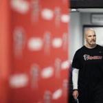 Atlanta Falcons head coach Dan Quinn walks into a press conference at the football team's practice facility in Flowery Branch, Ga., Wednesday, Jan. 25, 2017. The Falcons (13-5) take on the New England Patriots (16-2) in Super Bowl LI in Houston on Feb. 5, 2017. (AP Photo/David Goldman)