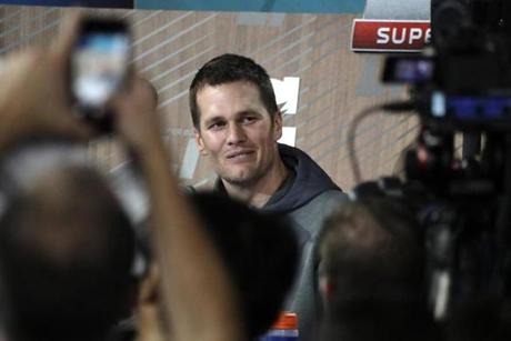 New England Patriots' Tom Brady answers questions during opening night for the NFL Super Bowl 51 football game at Minute Maid Park Monday, Jan. 30, 2017, in Houston. (AP Photo/Charlie Riedel)
