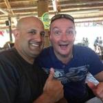 In a photo from a Facebook posting, Colonel Victor Garcia (left) posed on vacation with his friend Simon Bergman.