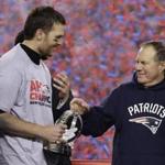 New England Patriots quarterback Tom Brady, left, holds the AFC Championship trophy as he celebrates with head coach Bill Belichick after the AFC championship NFL football game, Sunday, Jan. 22, 2017, in Foxborough, Mass. The Patriots defeated the the Pittsburgh Steelers 36-17 to advance to the Super Bowl. (AP Photo/Matt Slocum)