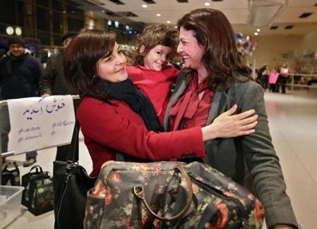 East Boston MA 2/4/17 Dr. Mahboubeh Asgari-Targhi (cq), left an Astrophysicist working at the Harvard-Smithsonian Center for Astrophysics greeting her sister, Amene Asgari (cq) and her neice Sophie Voss (cq) 2 1/2 who just arrived on British Airways from London via Glasgow Scottland at Logan Airport's International Terminal E. (Photo by Matthew J. Lee/Globe staff) topic: reporter: 
